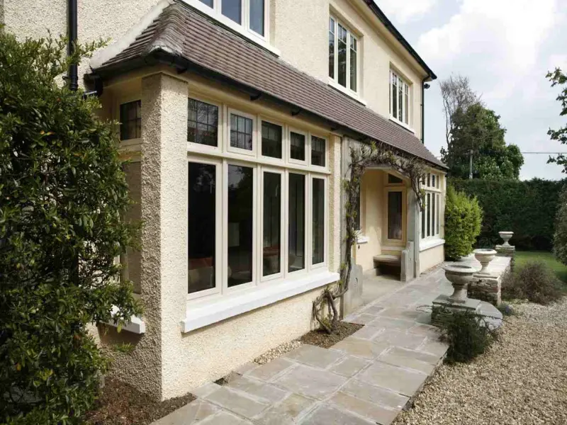 Cream-Aluminium-Windows Aluminium windows in a rendered property with leaded glass