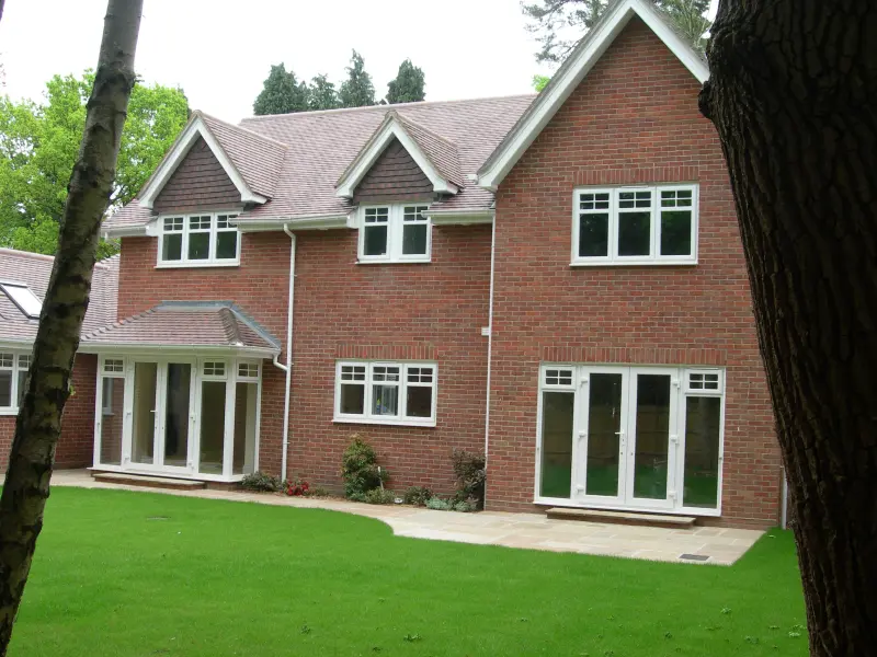 Storm-casement-windows Storm casement windows in white UPVC with Georgian detail to the top lights