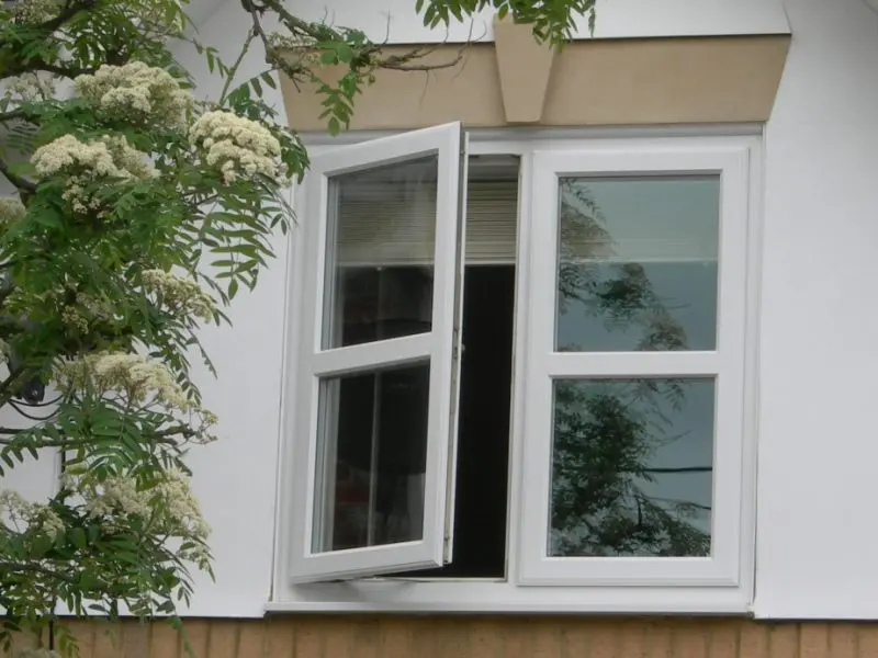 White-UPVC-window White UPVC window shown open with full height locking system